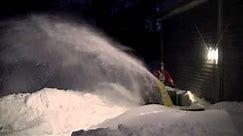 John Deere 318 blowing snow