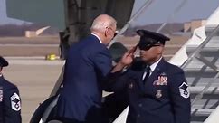 President Biden almost falls while walking up Air Force One stairs