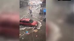 Flooding carries trash thru streets of New York City