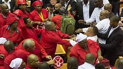 Brawl in South African parliament after opposition party ejected - video