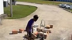 Guy Loses Control and Drops Boxes While Unloading Them From Truck
