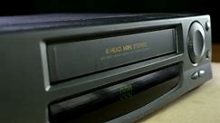 Inserting a VHS Tape into a VCR Player