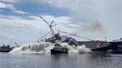 US Navy warship narrowly misses tugboat during side-launch in Wisconsin | US News | Sky News