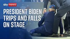 President Biden trips and falls on stage during graduation ceremony