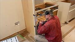 Episode 222: Kitchen cabinets: installing the refrigerator side panels and the first base cabinet!