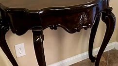 ONLY $249.00 for this beautiful ornate entryway table. It's solid wood with no veneer and a walnut stain, circa 1920 - 1940. A perfect fit for your home? Dimensions are 36"L x 18"W x 33"H. Plus a 20% DISCOUNT if you are a veteran, a first responder, or a teacher! Refinished by a WWII Veteran ❤🤍💙 Come see this fine piece in person at Southern Flair on the Square. The picture just doesn't do it justice! | Southern Flair on the Square