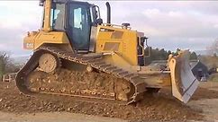CAT D6 dozer at work pushing gravel for road construction (part 1)