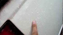 Car clear coat peeling from rain
