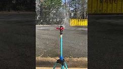 International sprinkler head on an American tripod sprinkler