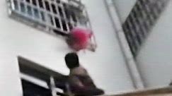 Crews free girl hanging from sixth-story window