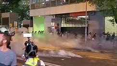 Hong Kong riot police suffer effects on tear gas