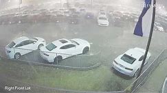 Surveillance video of baseball-sized hail damaging new vehicles in Cullman, Alabama