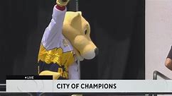 Denver Nuggets mascot Rocky celebrates with fans during the NBA championship parade