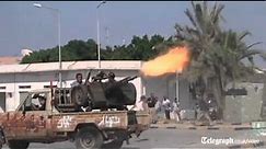 Libya conflict: rebels fight their way into Col Gaddafi's compound