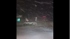 Heavy snow falls on Georgia gas station