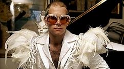 Elton John's Outfits Through the Years