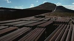Piles of metal beams sit unused along southern border