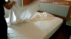 Profesional making bed duvet king..