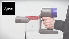 How to replace the clear bin on your Dyson V7™ cordless vacuum.