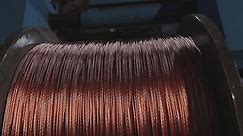 Cable manufacturing facility. A coil of copper cable. Copper cable manufacturing. Non-ferrous metal plant. Wire cable manufacture.