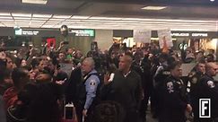 Watch Sen. Cory Booker Show His Support for Protesters at Washington-Dulles International Airport