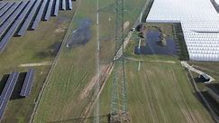 power pole utility electricity line high angle aerial drone foil tunnel
