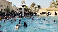 Video shows protesters taking over Iraqi palace, swimming in pool