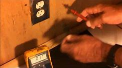 Using a multimeter to check an ac wall outlet