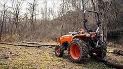 Skidding Logs Kubota L2501 Compact Tractor