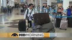 More air travelers choosing not to check their luggage