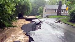 Northeast flooding washes away cars, collapses roads
