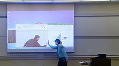 Math professor fixes projector screen (April Fool's prank)