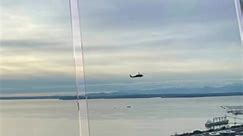 Watching a helicopter fly by from inside the Space Needle in Seattle Washington | Wild Flowers are for Free
