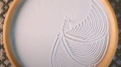 This kinetic sculpture creates infinite art patterns in the sand