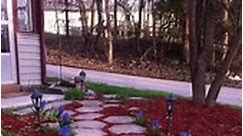 I really liked the appearance of the red mulch, blooming hyacinths and stepping stones but I wouldn’t trade them for my poured concrete walkway. | Leanne Foddrill Walls