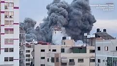 Towers collapse as high-rise hit in Gaza