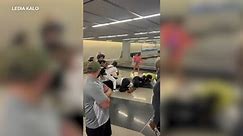 Caught on camera: 2 charged after brawl at O'Hare Airport baggage claim, Chicago police say