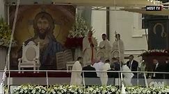 Pope Francis falls during service