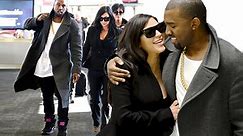 Pictured: Kanye West dotes over beaming 'baby mama' Kim Kardashian as pair emerge for first time since pregnancy news