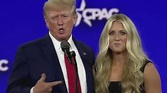 Swimmer appears to dodge Donald Trump as he tries to kiss her on stage at CPAC