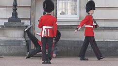 Buckingham Palace guard slips and falls in front of hundreds of tourists