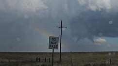 Tornado Spins Near Rainbow in Central New Mexico