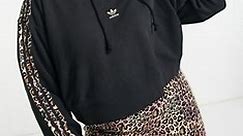 adidas Originals Plus cropped hoodie with leopard print stripes in black | ASOS