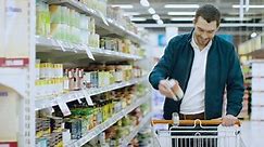 At The Supermarket: Handsome Man Stock Footage Video (100% Royalty-free) 1015782322