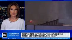 Firefighters continue battling mattress warehouse fire in North Brunswick