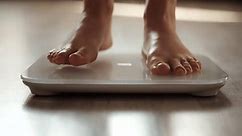 Weight Lose Scales Measure Weight Girl Stock Footage Video (100% Royalty-free) 1105052375 | Shutterstock
