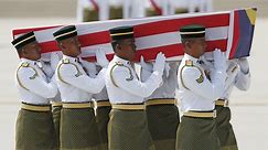 MH17 Bodies Flown Back to Malaysia