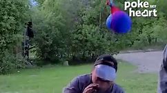 People Get Wet in Water Balloon Game While Sitting on Chair Blindfolded