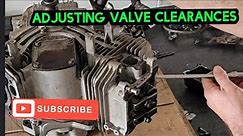 Adjusting a mower engine's valve clearances