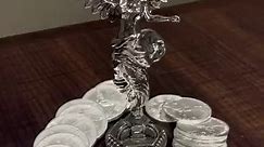 These stunning sterling silver statues depict two of the most iconic symbols of freedom and strength: the Mexican Libertad and the British Britannia. Libertad is a winged female figure who represents Mexico's independence from Spain. She is often depicted holding a torch and a broken chain, symbolizing the light of freedom and the breaking of oppression. Britannia is a female figure who represents Britain. She is often depicted wearing a crown and holding a trident, symbolizing her power and aut